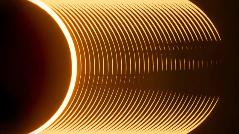 Abstract image composed of concentric and curved light lines creating a layered pattern and shadows on a dark background. The pattern forms a glowing crescent shape on the left, radiating out to the right.