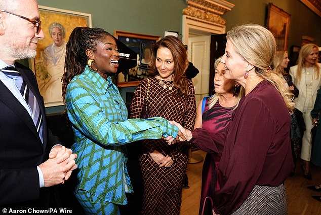 The mother-of-two greeted BBC radio and television presenter Clara Amfo, who looked radiant in a turquoise and green outfit.